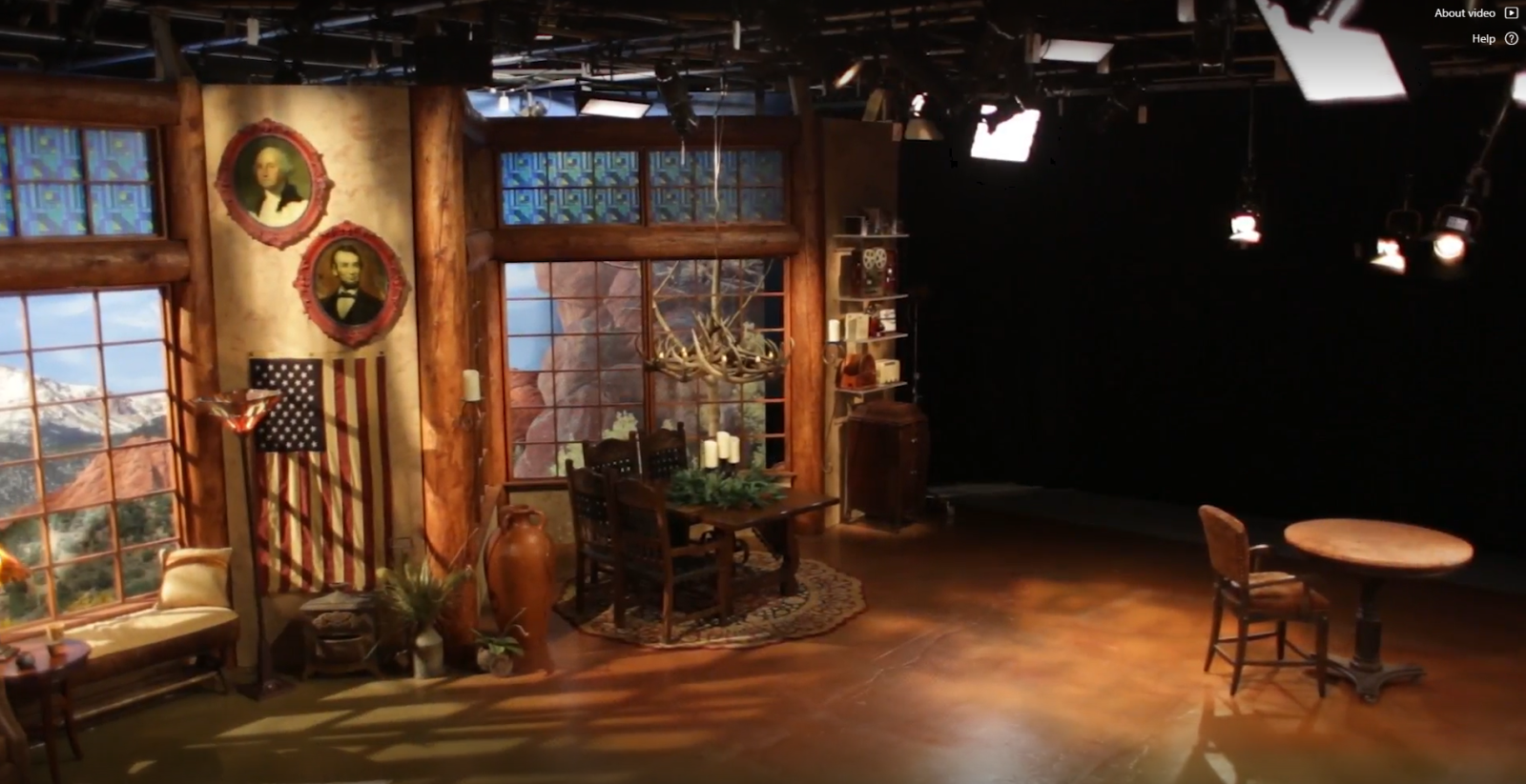 tv studio with chandelier and table